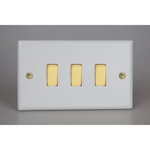 XY93V.MW Varilight 3 Gang 10 Amp Switch Vogue Matt White Effect Finish With Polished Brass Switches On a Double Plate